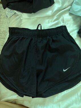Nike Women’s Black Athletic Shorts with Silver Swoosh